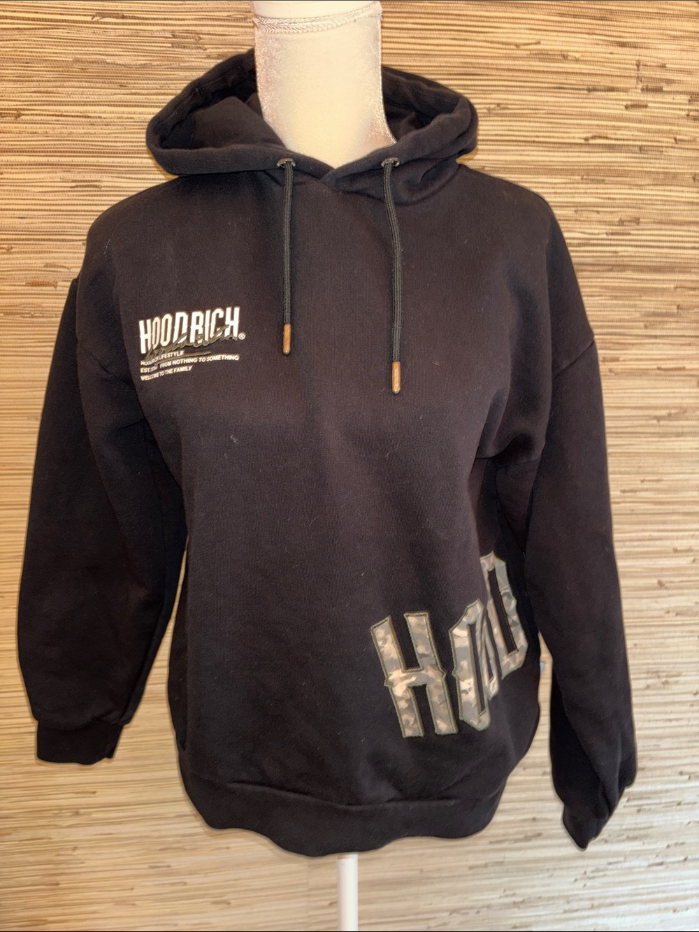 Hoodrich small black sweatshirt with camo lettering.